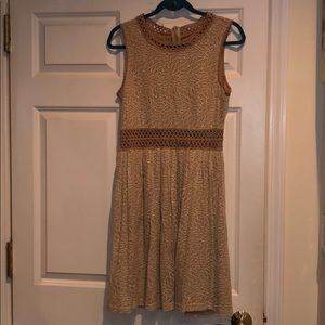 Beige dress with small cutouts at midriff